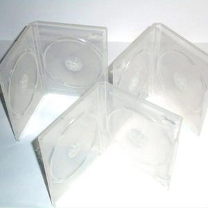 May include: A white ceramic mug with a black handle and the text "But First, Coffee" in a bold, black font. The mug is set against a neutral background, highlighting its simple design.