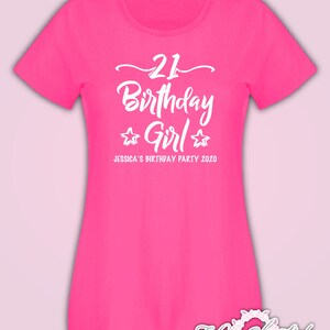 May include: Pink t-shirt with white text that says "21 Birthday Girl" with two stars on either side of the word "Girl". The text below says "Jessica's Birthday Party 2020".