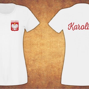 May include: White t-shirt with a red and white Polish coat of arms on the left chest and the name "Karolina" in red script on the back.