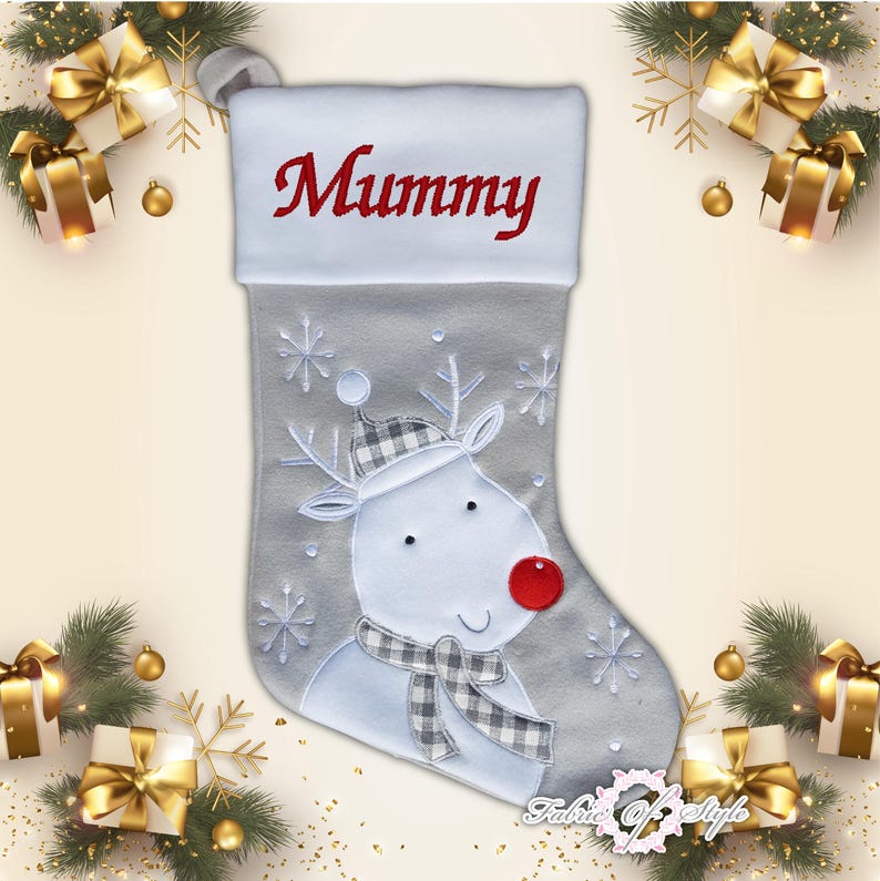 May include: A gray Christmas stocking with a white reindeer design and the word "Mummy" embroidered on the cuff.