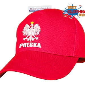 Puede incluir: Gorra de béisbol roja con un águila polaca bordada en blanco y la palabra "POLSKA" en la parte delantera.