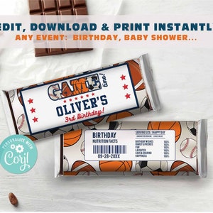 May include: A printable chocolate bar wrapper with a sports theme. The wrapper features a basketball, baseball, and soccer ball, along with the text "Game Time!" and "Oliver's 3rd Birthday!"