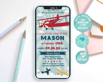 May include: A digital invitation for a first birthday party with a blue and red aeroplane theme. The invitation is designed to look like a smartphone screen and includes the text "My, Oh My, this year has flown by!" and "Join the fun! Mason is turning one. Saturday 09.28.22 2:30 PM. Mason's Airport 123 Main Street New York, NY 12345 RSVP to the travel agent Amanda at 123-456-7890".