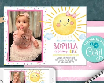 May include: A personalized first birthday invitation with a yellow sun with a pink bow and a smiling face. The invitation says "Our Little Sunshine Sophia is turning One".