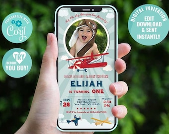 May include: A digital invitation for a first birthday party with a blue and red airplane theme. The invitation features a photo of a baby boy wearing a pilot hat and goggles. The text on the invitation reads "Elijah is turning one" and includes details about the party, such as the date, time, and location. The invitation is displayed on a smartphone screen.