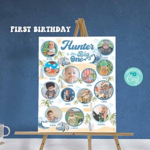 May include: A white poster with a blue and yellow beach theme. The poster says "Hunter is the Big One" and has 12 photos of a baby boy in different outfits. The poster is on an easel.