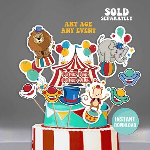 K&ouml;nnte beinhalten: Zirkus-Tortenaufleger mit einem rot-wei&szlig; gestreiften Zelt, einem L&ouml;wen, einem Elefanten, einem Affen und Clowns. Die Aufleger sind auf St&ouml;cken und bereit, auf eine Torte gelegt zu werden.