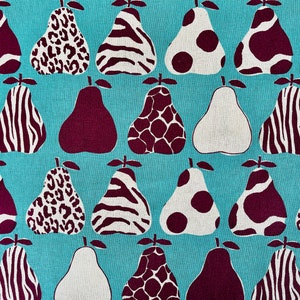 May include: A turquoise fabric with a repeating pattern of pears. The pears are in various patterns, including zebra stripes, leopard spots, and polka dots. The pears are in shades of white, brown, and burgundy.