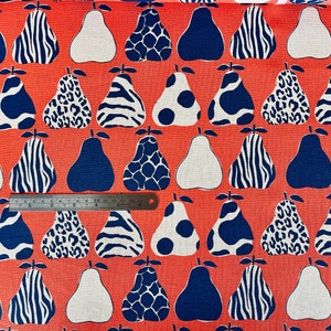 May include: Red fabric with a repeating pattern of white and blue pears. The pears have different patterns, including zebra stripes, leopard spots, and polka dots.