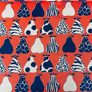 May include: A coral orange fabric with a repeating pattern of pears. The pears are in various designs, including zebra stripes, leopard spots, polka dots, and a geometric pattern. Some pears are white, some are blue, and some are a combination of white and blue.
