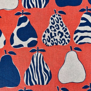 May include: A coral red fabric with a repeating pattern of blue and white pears. The pears have different patterns, including zebra stripes, leopard spots, and cow spots.