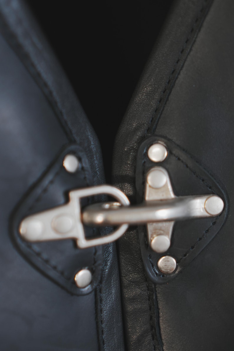 Metal buckle and rivet detail on Harley Davidson style vest