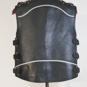 Shoulder detail of Harley style biker vest with buckle straps
