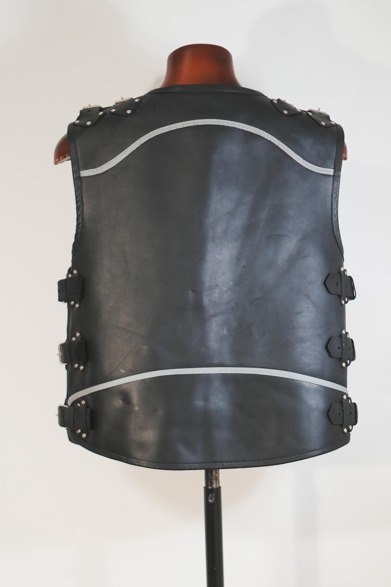 Shoulder detail of Harley style biker vest with buckle straps