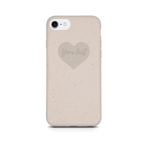 Puede incluir: Una funda de tel&eacute;fono beige con textura moteada y un recorte en forma de coraz&oacute;n con el texto "Your text" en su interior.