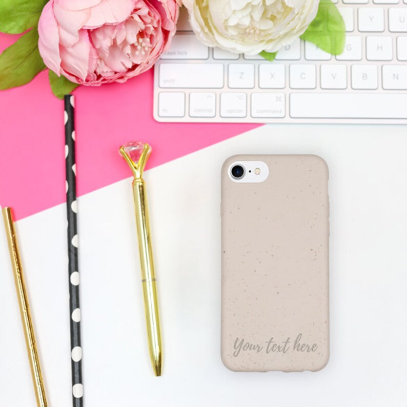 Flatlay of custom compostable white phone case