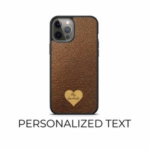 May include: A brown textured phone case with a black border. A wooden heart with the words "My favourite" is in the centre. The words "PERSONALIZED TEXT" are at the bottom.