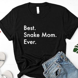 May include: Black t-shirt with white text that reads "Best. Snake Mom. Ever."