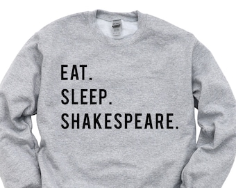 May include: Gray sweatshirt with black text that reads "Eat. Sleep. Shakespeare."