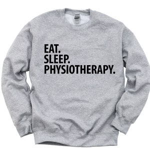 May include: A gray sweatshirt with the text "Eat. Sleep. Physiotherapy." printed in black.