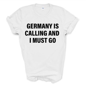 May include: White t-shirt with black text that reads "Germany is calling and I must go."
