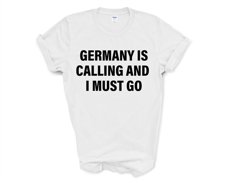 May include: White t-shirt with black text that reads "Germany is calling and I must go."