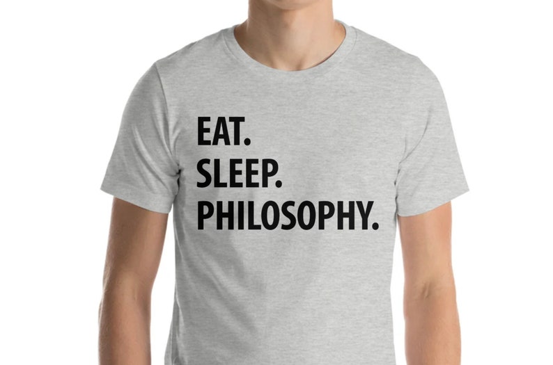 May include: A heather grey t-shirt with black text that reads "EAT. SLEEP. PHILOSOPHY."