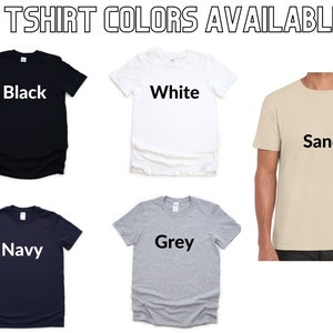 May include: Five t-shirts in different colors: black, white, sand, navy, and grey.  The text "T-SHIRT COLORS AVAILABLE" is at the top of the image.