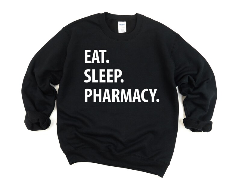 May include: Black sweatshirt with white text that reads "Eat. Sleep. Pharmacy."