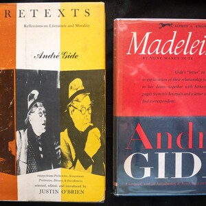 May include: Two vintage books by André Gide. The book on the left is titled "Pretexts" with a yellow and orange cover and a portrait of the author. The book on the right is titled "Madeleine" with a red and blue cover.