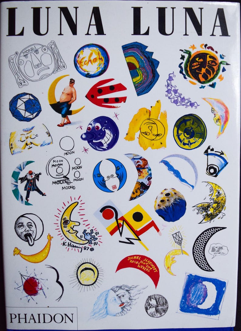 May include: A book cover titled "LUNA LUNA" with various colorful illustrations of moons, faces, and abstract shapes. The cover features the text "PHAIDON" at the bottom and the artist's signature "K.Hami '87".