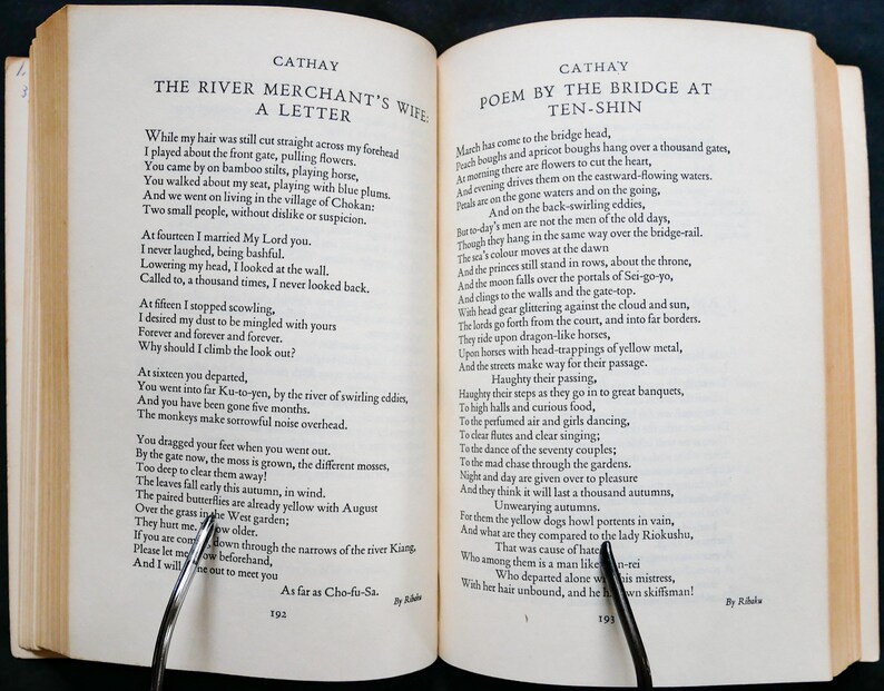 May include: A vintage book with two pages open, showing a poem titled "Poem by the Bridge at Ten-Shin" and a letter titled "The River Merchant's Wife: A Letter". The text is in black ink on white paper.