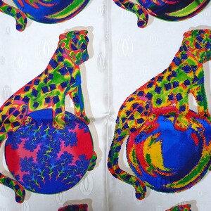 May include: Two colorful leopards are sitting on top of spheres. The leopards are green, yellow, blue, and red. The spheres are blue, yellow, red, and green. The background is white with a repeating pattern.