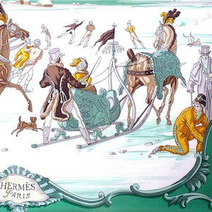 May include: A silk scarf depicting a winter scene with ice skaters and horse-drawn sleighs. The scarf has a white background with a green border and the text "HERMÈS PARIS". The illustration includes horses, people, and a small dog.