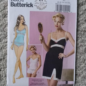 May include: Butterick B6031 sewing pattern for lingerie. The pattern features illustrations of a camisole and shorts set, and a nightgown with lace trim. The pattern includes sizes 6-8-10-12-14.