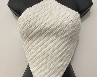 May include: A white, handmade crochet halter top. The top is displayed on a black mannequin. The halter top features a diagonal stitch pattern and a tie-up halter neck. The top is a solid white colour.