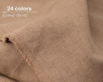 May include: Close-up of a brown fabric with a textured weave. The fabric is folded over and the edges are frayed. The text "24 colors Ramie series" is visible in the top left corner of the image.