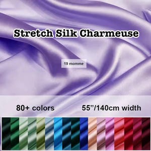May include: Lilac-colored Stretch Silk Charmeuse fabric with a lustrous sheen. The image displays the fabric's texture and drape, with text indicating 80+ colors available and a width of 55 inches (140cm). A color palette of various shades is shown at the bottom.
