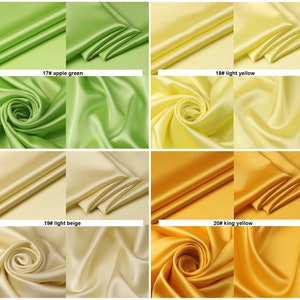 May include: Four swatches of silky fabric in different shades of yellow and green. The swatches are labeled with numbers and color names: 17# apple green, 18# light yellow, 19# light beige, and 20# king yellow.
