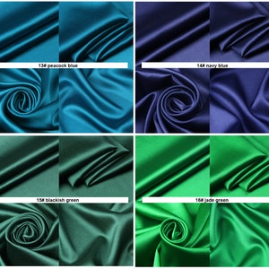 May include: Four swatches of fabric in different colors: peacock blue, navy blue, blackish green, and jade green. The fabric is a smooth, silky satin.