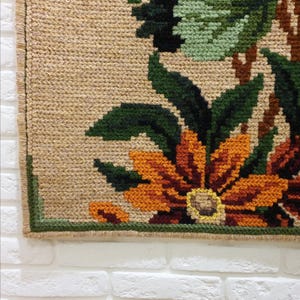 Handmade embroidered wool wall art with floral motif, decorative panel for interior walls