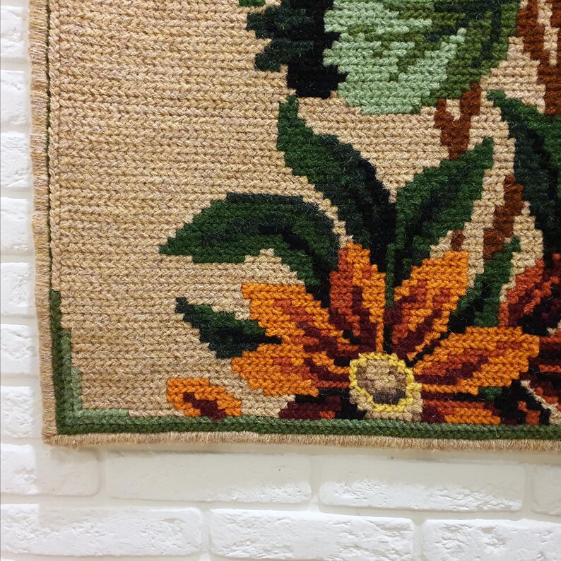Handmade embroidered wool wall art with floral motif, decorative panel for interior walls