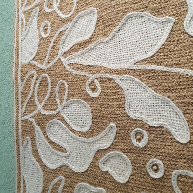 Embroidered fiber art with leaf pattern and layered wool texture for wall decoration