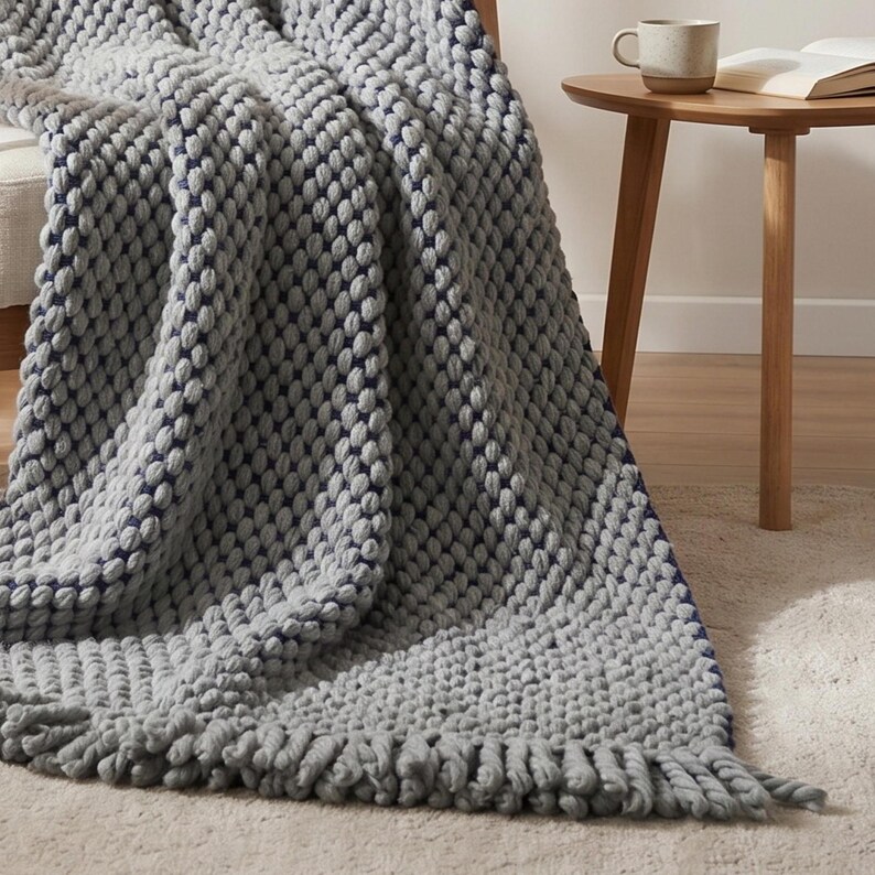 Wool blanket in interior setting with natural light highlighting depth and texture.
