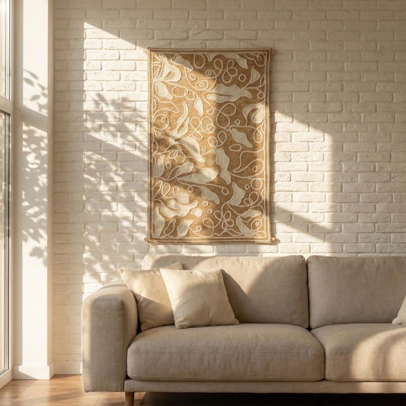 Neutral wall panel with textured wool embroidery and abstract leaf composition