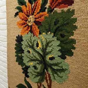 Embroidered wall panel with orange flowers and green leaves made from wool, textured fiber wall decor