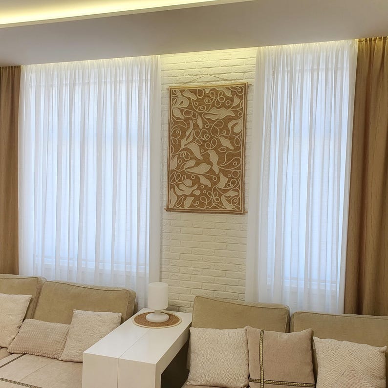 Textile wall art with structured wool embroidery and subtle organic composition