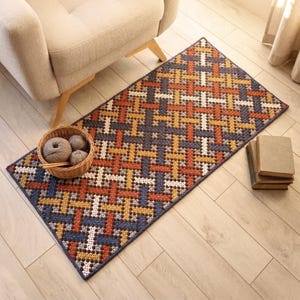 Chair accent color rug in a warm living room. Geometric lines pattern rug.