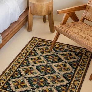 Handmade embroidered wool rug on jute base, 56x30 inches. Folk floor runner with textured wool stitching in natural earthy tones for rustic home decor.