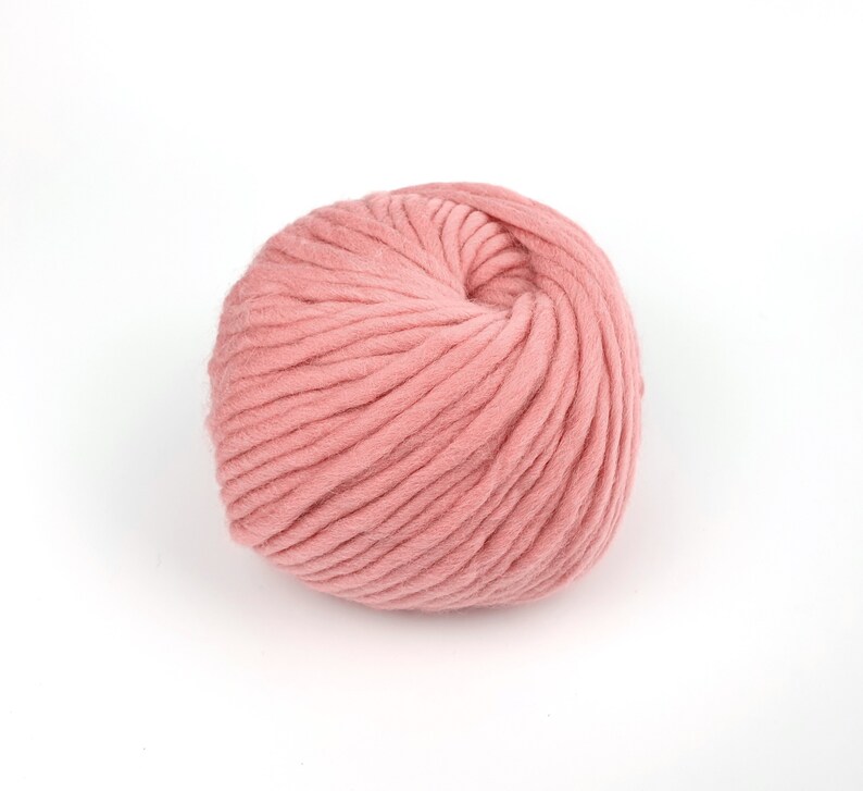 May include: A ball of soft, pink yarn.